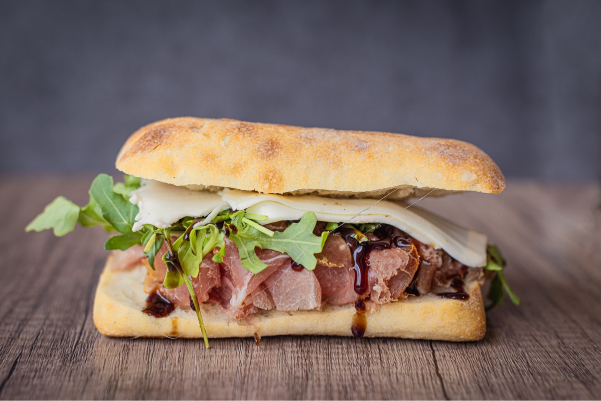 Italian sandwich with prosciutto, mozzarella and arugula