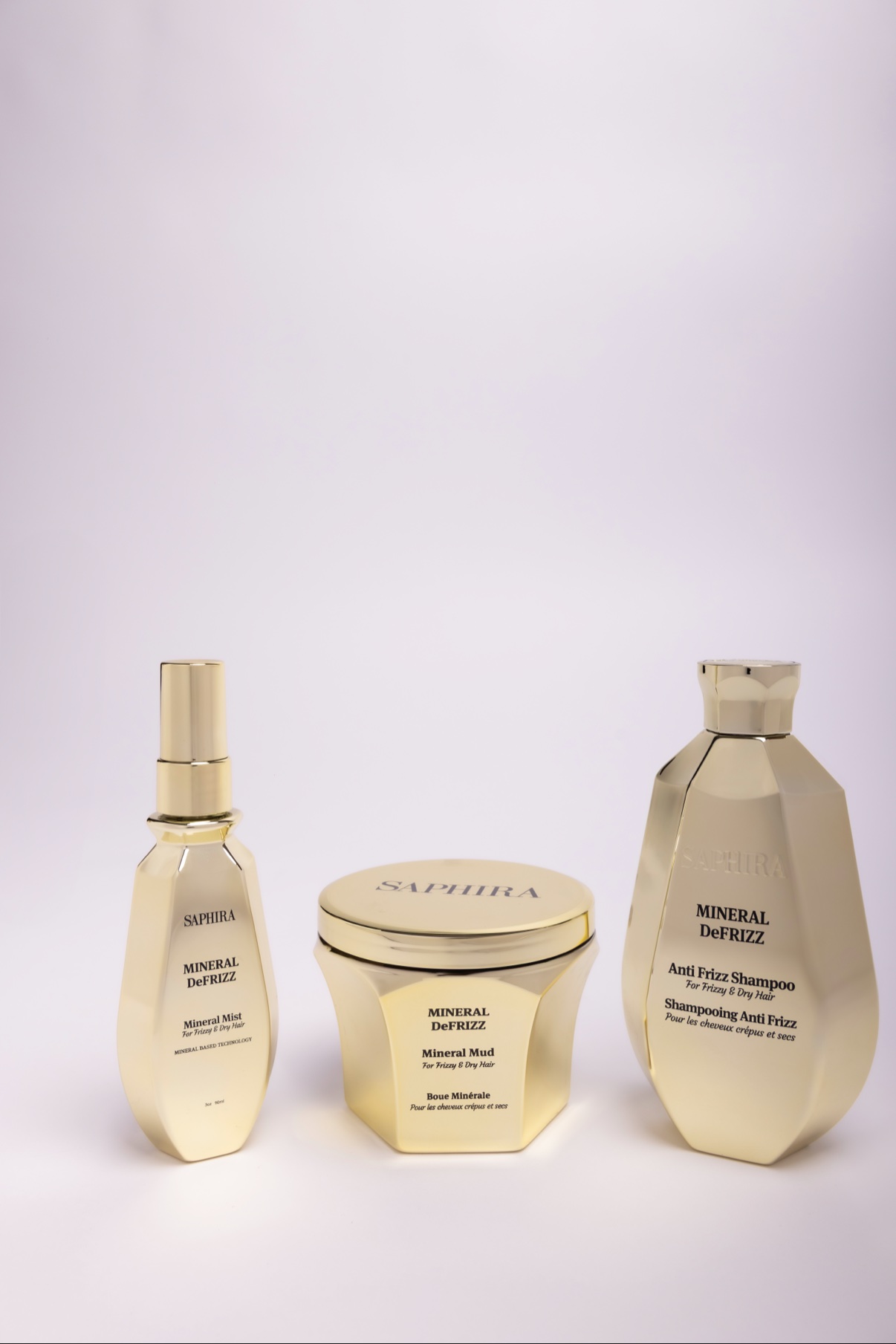 Golden Saphira Mineral DeFrizz hair-care trio on white