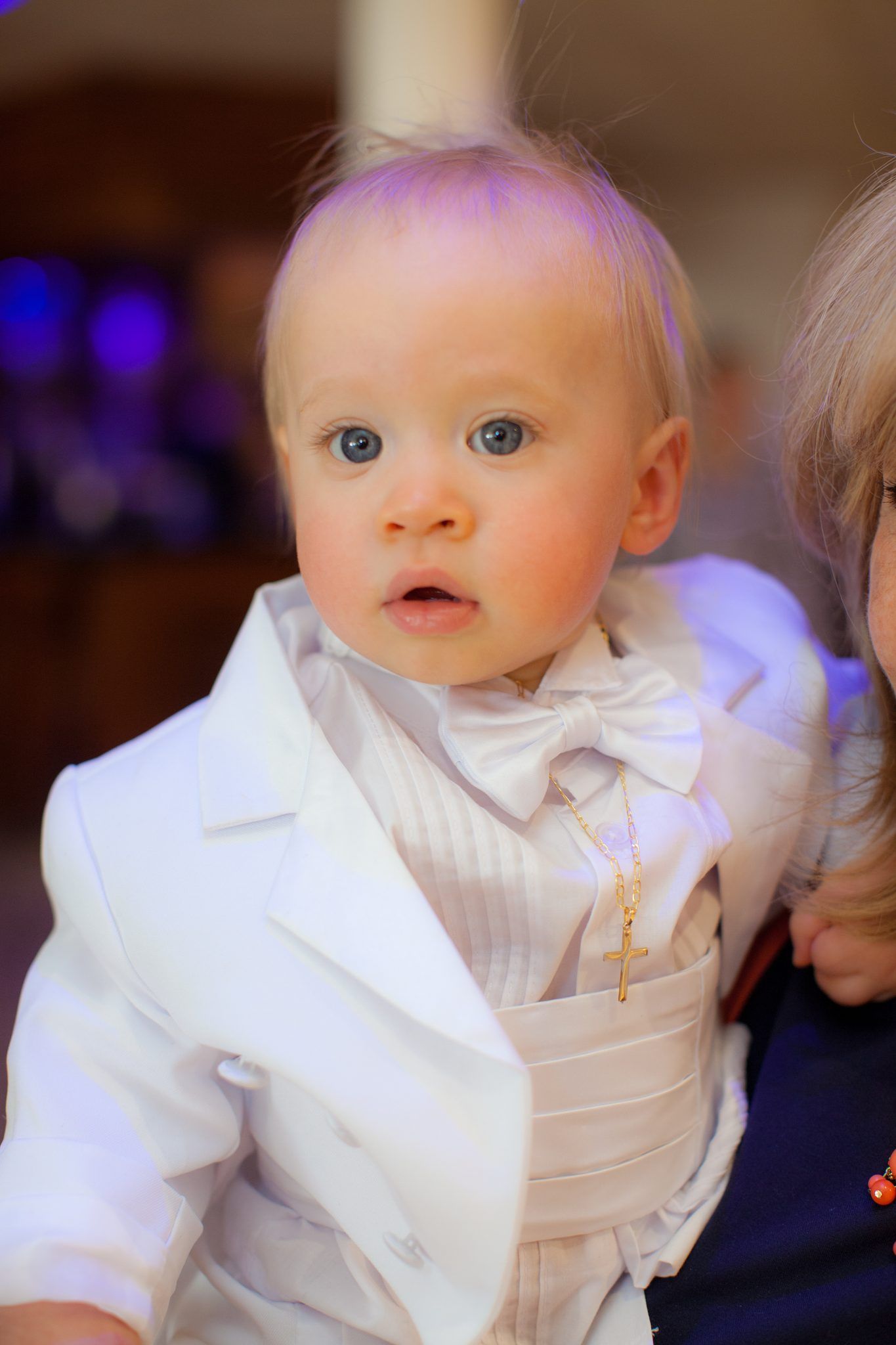 Family of five in gold and white outfits