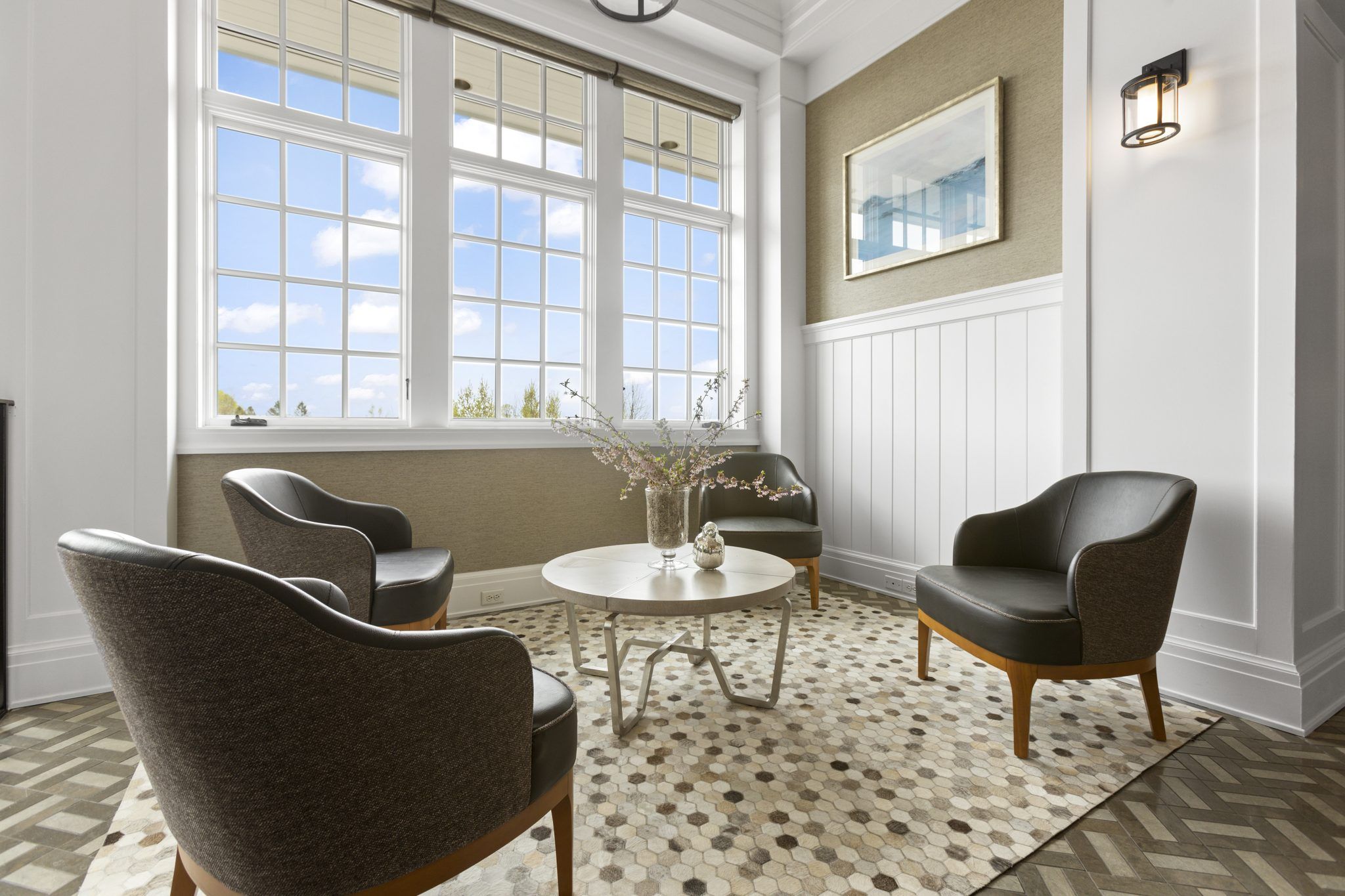 Hotel sitting area with four armchairs