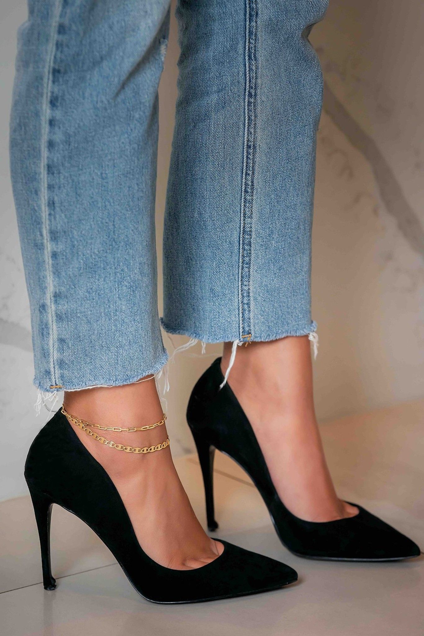 Gold anklet with black heels