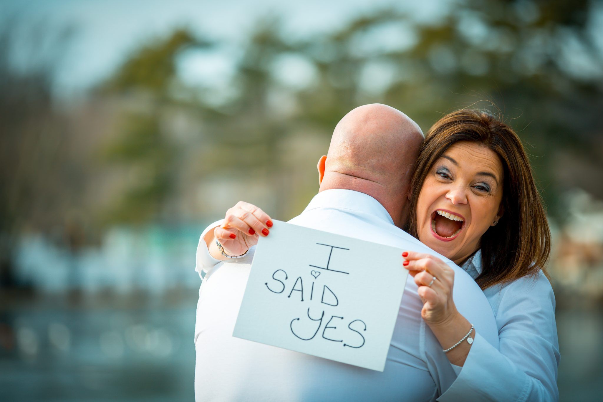 Couple holding an I said yes sign