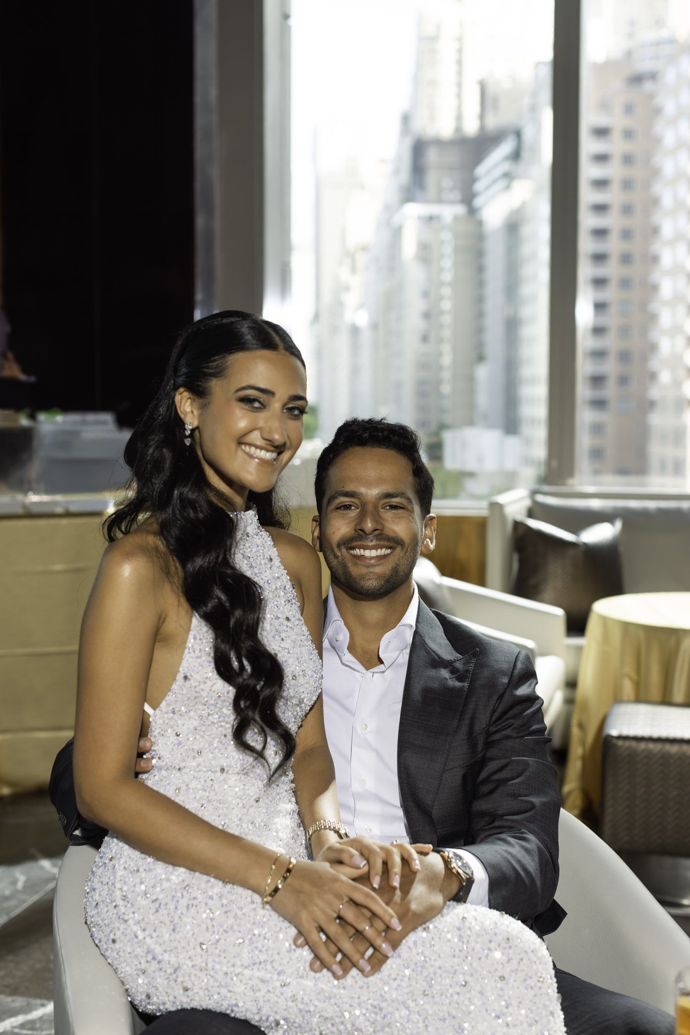 Couple by a window with a city view